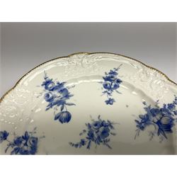 Early 19th century Nantgarw 'Lady Seaton' porcelain plate, circa 1820, hand painted with cobalt blue enamel floral sprays, with shaped and scroll moulded rim within a gilt line, with impressed marks beneath, D25cm