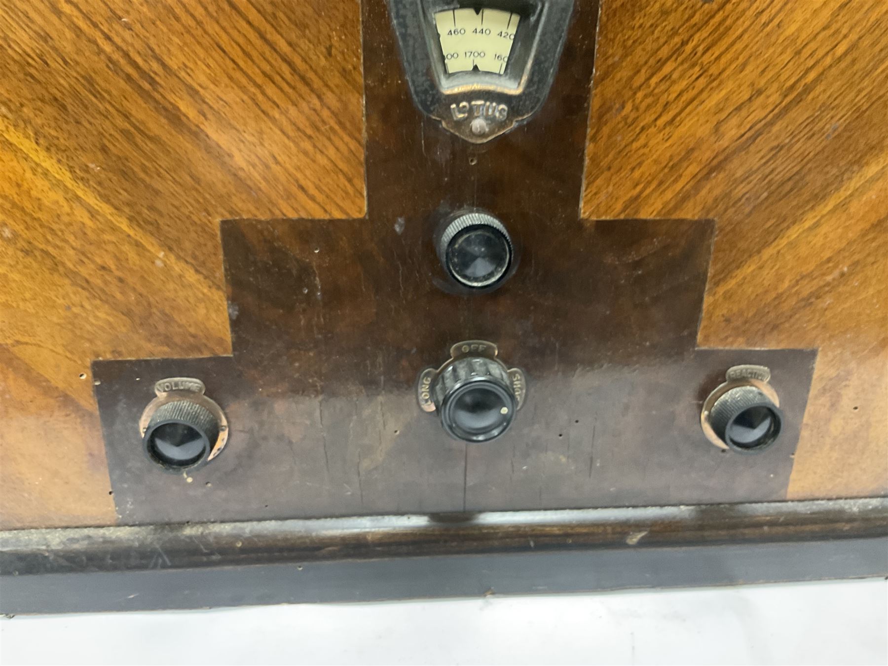 Two 1930s radios, comprising Art Deco Lotus valve example with copper fixtures, H50cm W37cm  together with a Swan Aerodyne example decorated with inlay