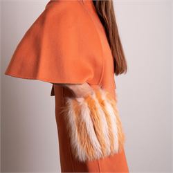 Fendi Roma - wool cape coat in 'Cayenne' orange peach, with concealed front fastening and short flared cape sleeves, applied with dyed arctic fox fur patch pockets, size 40, unused with original tags