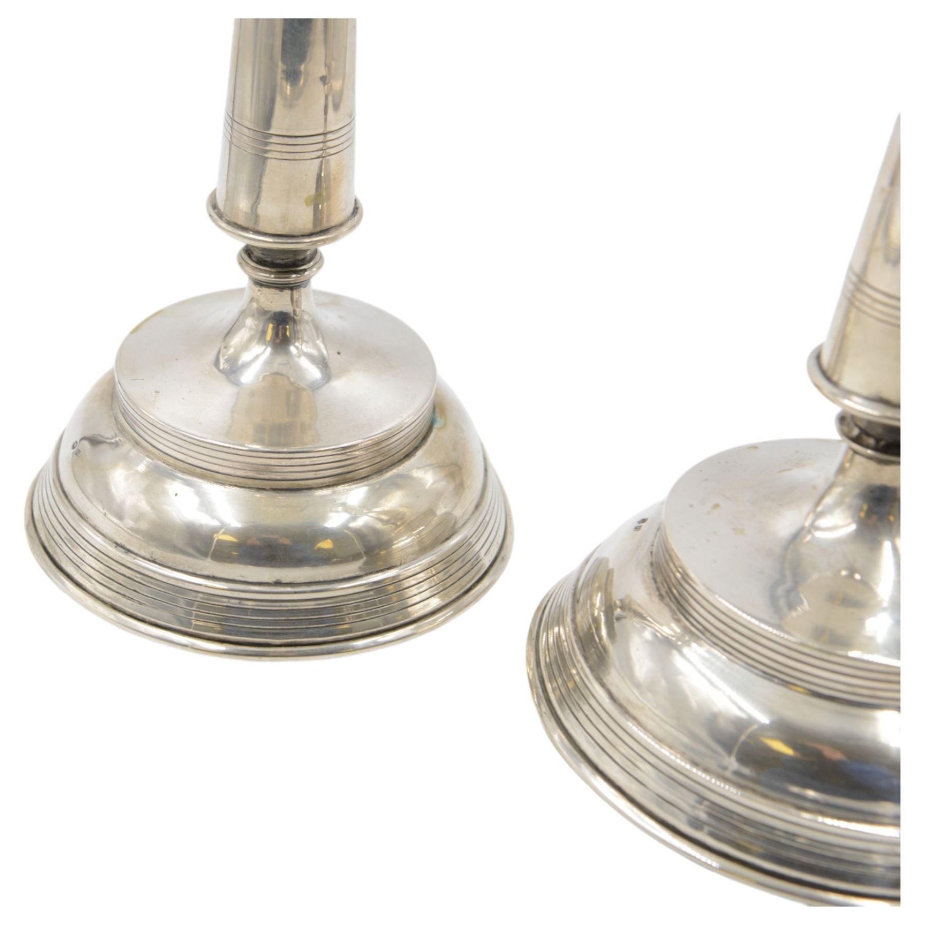 Pair of late 19th/early 20th century Austro-Hungarian 800 standard silver candlesticks, with tapering stems upon a domed base, stamped with Diana head with number 3 to the left, H33cm