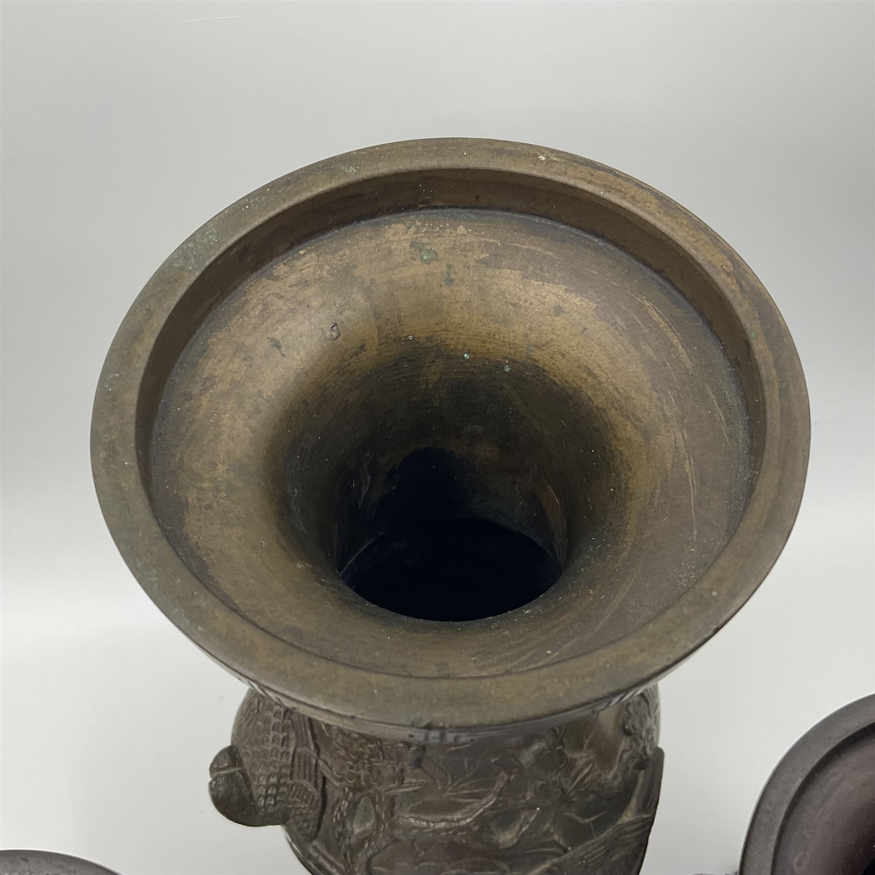 Chinese bronze vase, of baluster form with elongated neck, decorated in relief with birds amongst prunus blossom, together with a smaller pair of twin handled bronzed vases, decorated with peacocks and a blue Peking glass dish, with white metal mounted decorated with dragons, bronze vase H23.3cm