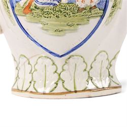 18th century South Yorkshire prattware jug, moulded in relief a band of stylised leaves,  with  'Mischievous Sport' and 'Sportive Innocence' pattern to the centre, H19cm