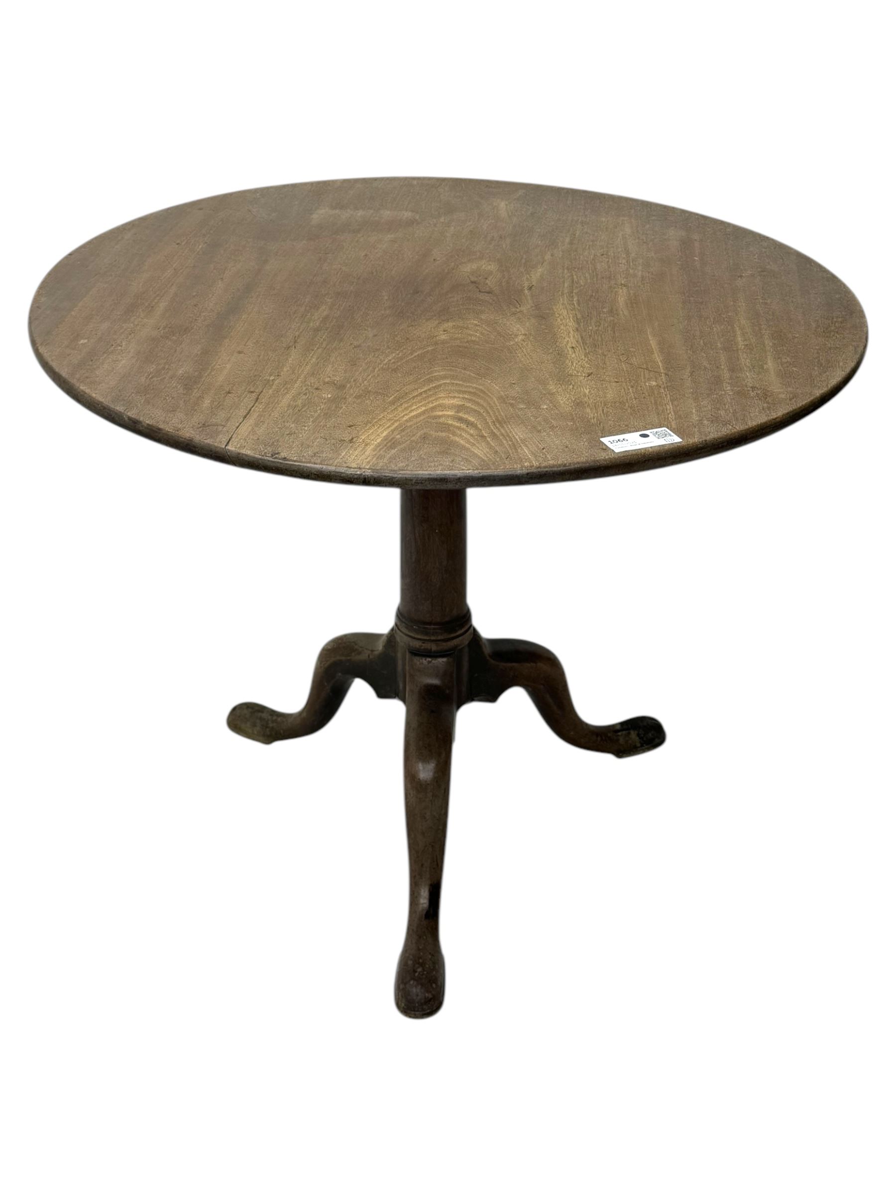 George III mahogany tripod table, folding hinged top above pedestal on three cabriole legs 