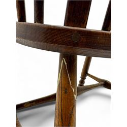 Early-to-mid 19th century elm and ash high-back Windsor armchair, central vase-shaped splat flanked by slender vertical spindles, outward-curving arms, shaped and dished saddle seat, raised on turned and splayed supports united by H-stretcher