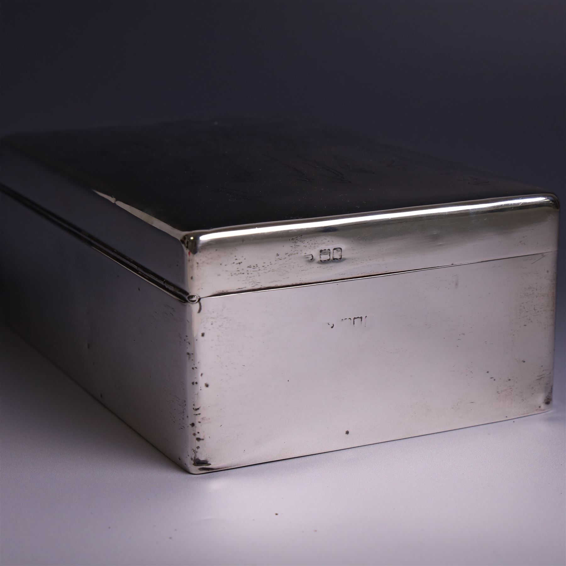 WWII silver mounted cigarette box, of rectangular form, the hinged cover inscribed 'presented to Major & Mrs James Bennett on the occasion of their marriage by the officers of the Liverpool Wardens Service October 1944' and engraved with twenty-four signatures of the officers, with softwood interior, hallmarks worn and indistinct, H7.5cm, W19cm