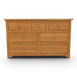 Solid oak chest of drawers, three over four drawers with metal pulls 