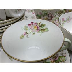 Royal Doulton Apple Blossom pattern tea service for twelve, comprising twelve saucers, twelve tea plates, twelve teacups, milk jug, sucrier and two cake plates