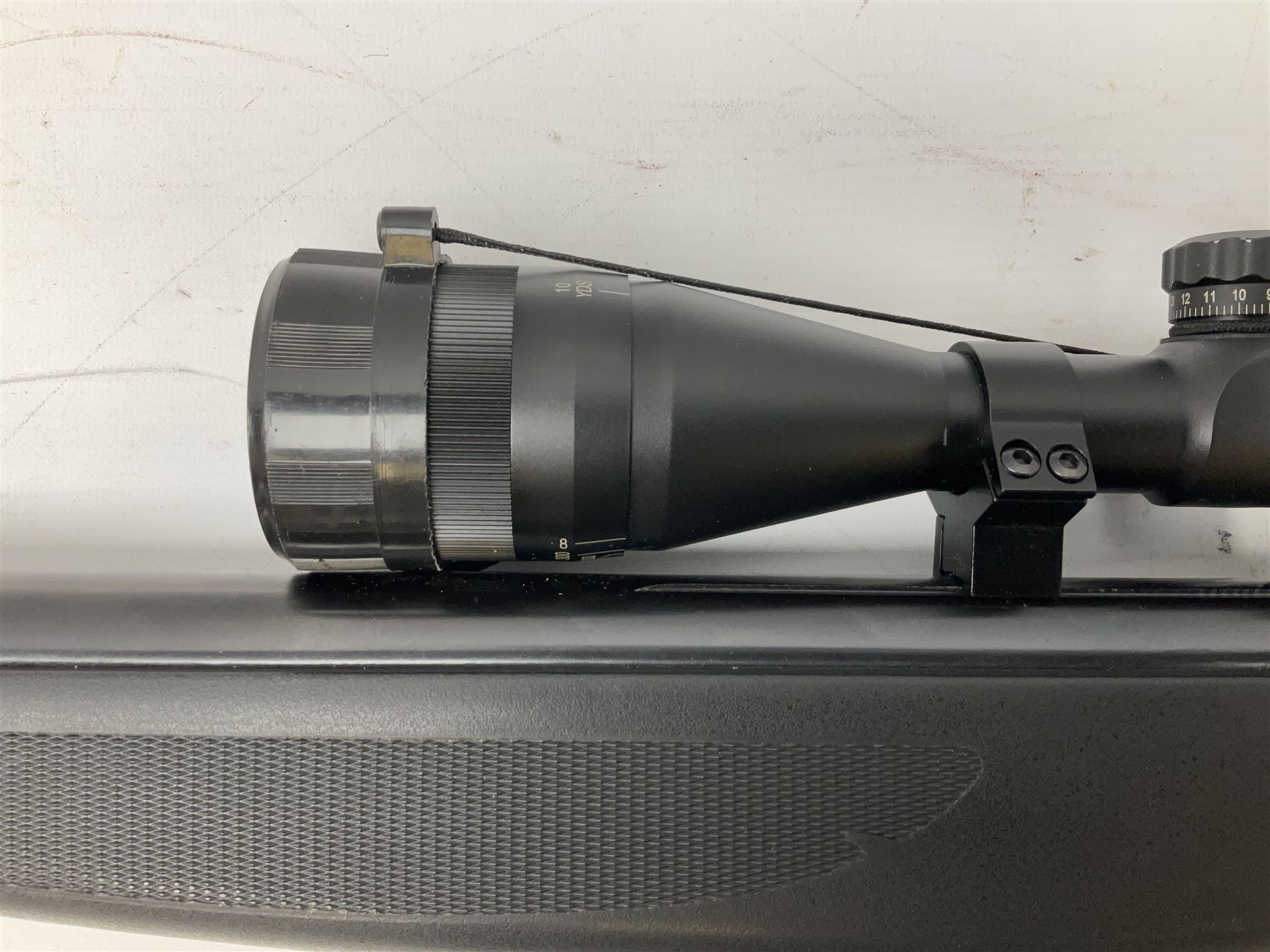 Stoegar .177 air rifle with break barrel action, 3 x 9 telescopic sight and fully integrated sound moderated barrel, no visible serial number, L109cm; in Stoeger lined gun sling