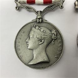 Victoria Long Service in the Volunteer Force Medal awarded to 369 Bombr. W. Woodward 1st Lincs. V.A.; and reproduction Victoria India Medal with Lucknow clasp; both with ribbons (2)