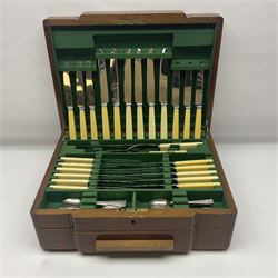 Art Deco canteen of silver plated cutlery for twelve place settings, including table and dessert knives with ivorine handles, retailed by Harrods Ltd, contained within a wooden case, with drawer to base, canteen case H15.5cm