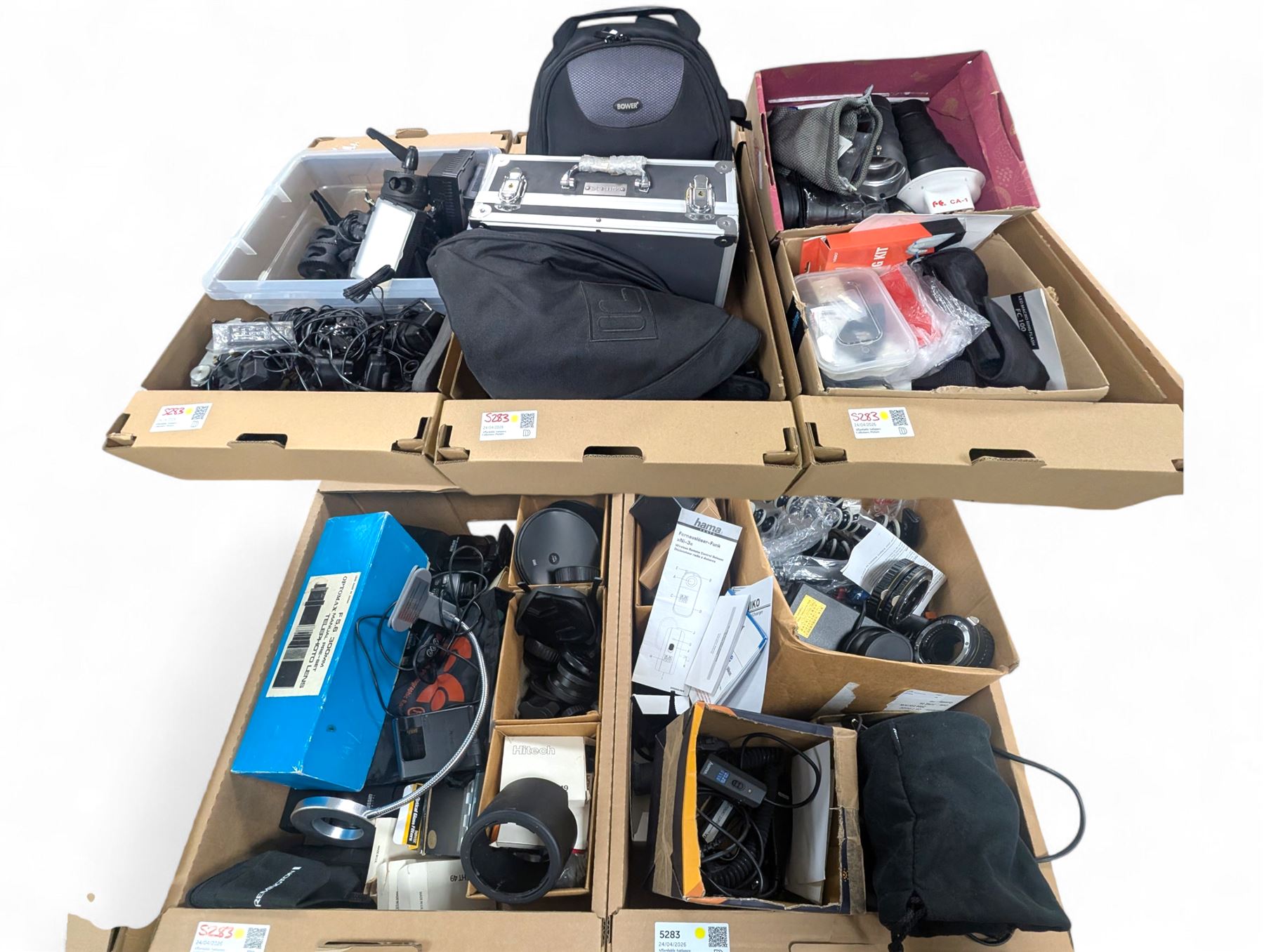 Collection of photography equipment, including flashes, hoods, filters, telephoto lens, bags, etc