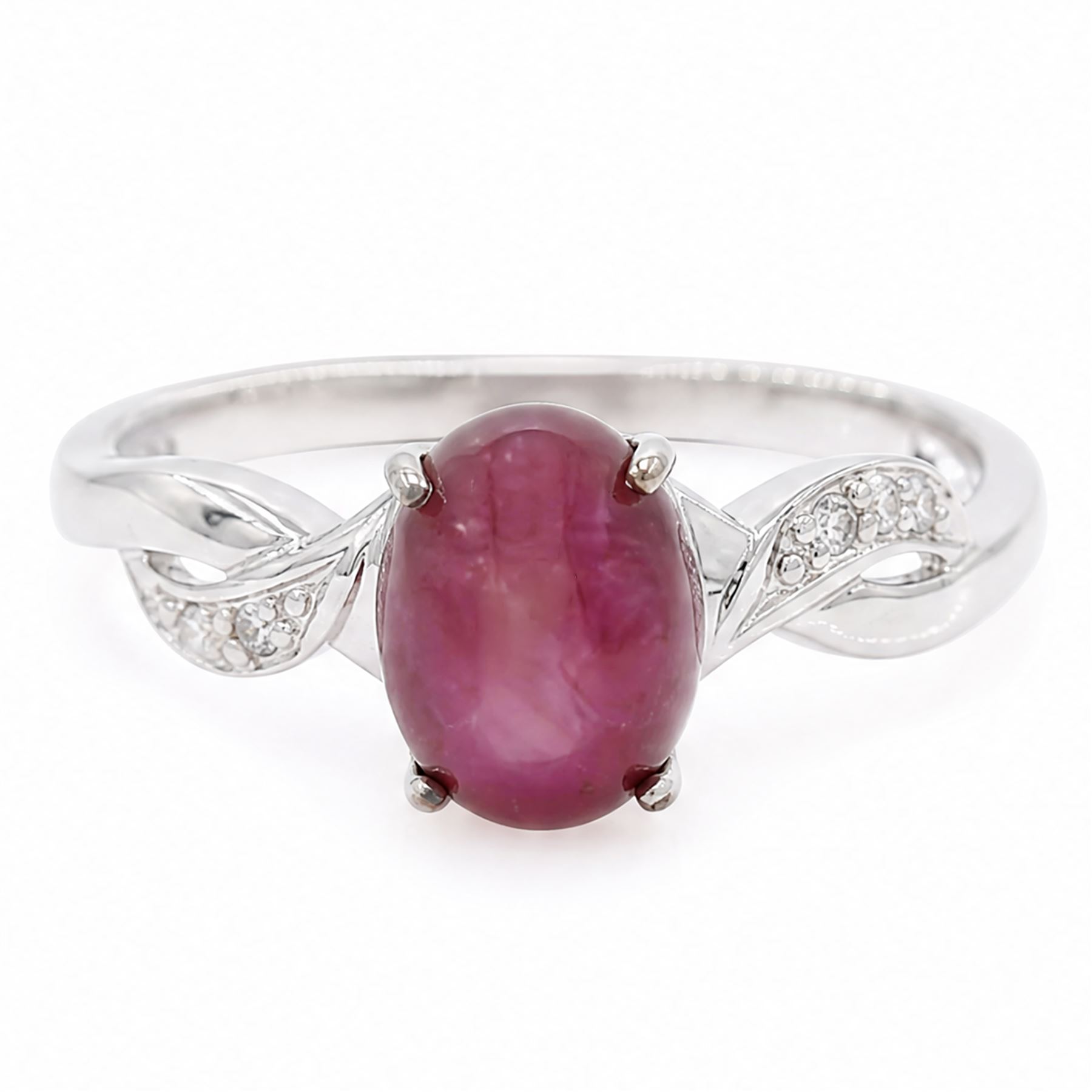 9ct white gold star ruby ring, single cabochon cut ruby, with crossover diamond chip shoulders, hallmarked