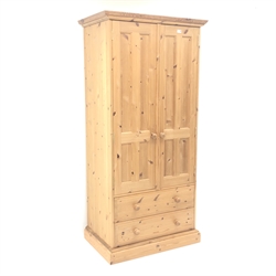  Solid Pine wardrobe, projecting cornice, two doors enclosing fitted interior above two drawers, plinth base, W91cm, H195cm, D59cm  