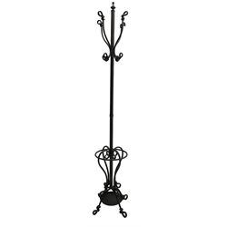 Bronze finish wrought metal coat stand, scrolled and twisted designed, the base with umbrella and stick stand 