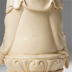 Three Chinese blanc de chine figures, each depicting Guanyin seated, Dehua province, two with double gourd and potters seal marks to the reverse 