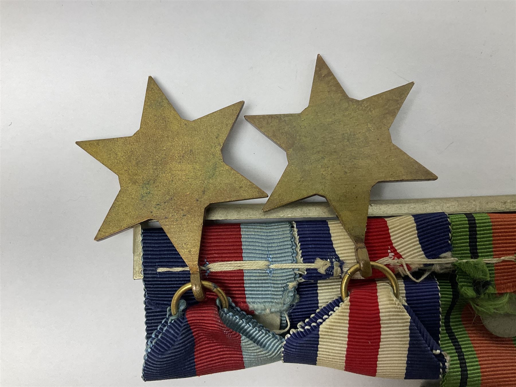 WW2 group of five medals comprising 1939-1945 War Medal, Defence Medal, 1939-1945 Star, France and Germany Star and Canadian Volunteer Service Medal; on wearing bar with ribbons; with a medal box and slip and three photographs