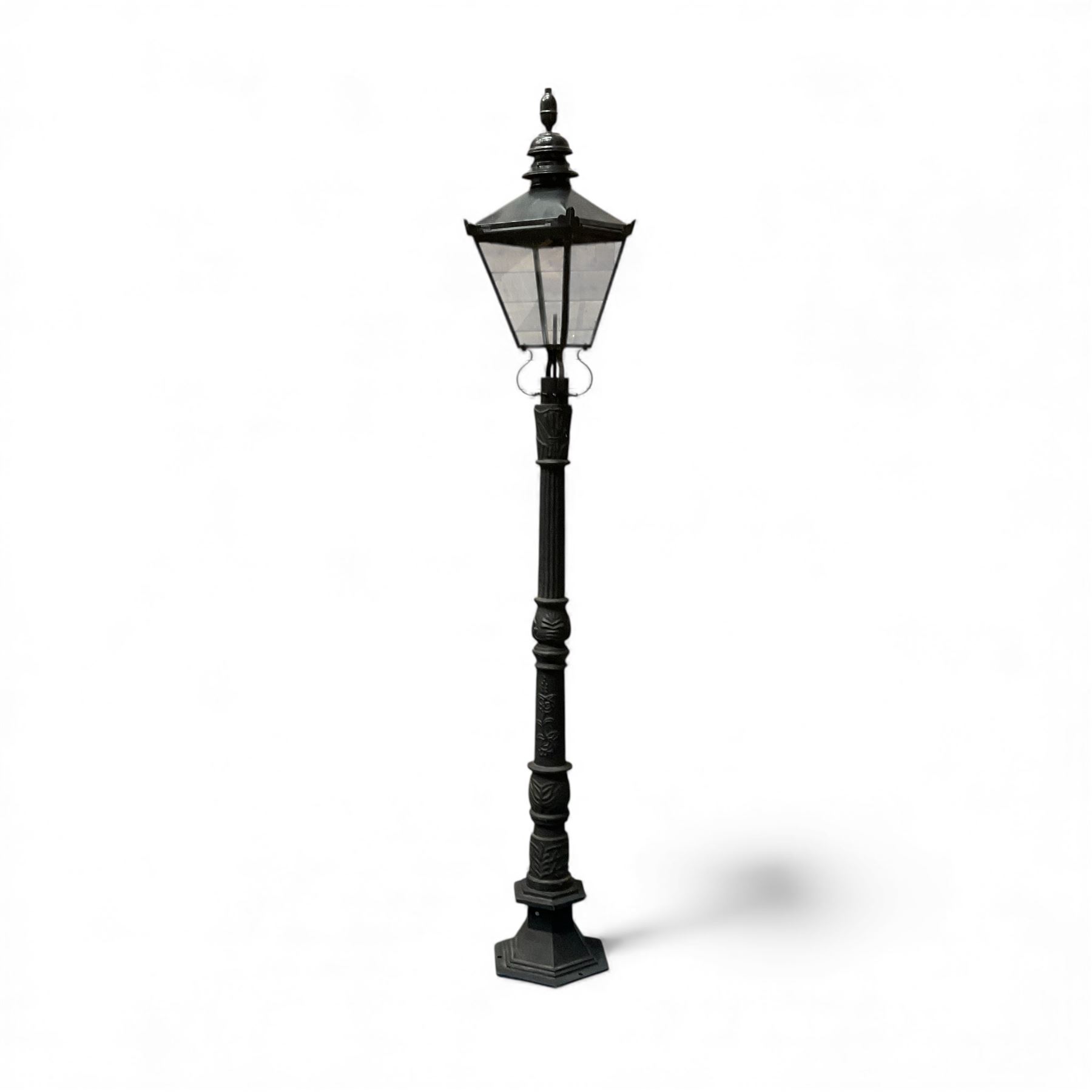 Victorian-style cast iron lamp post in a black finish,