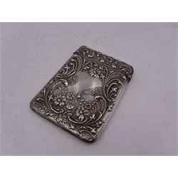 Edwardian silver card case, of typical rectangular form, with embossed floral and scrolling decoration throughout, engraved with monogrammed initials to front cover, hallmarked Cornelius Desormeaux Saunders & James Francis Hollings (Frank) Shepherd, Chester 1903, H9.7cm