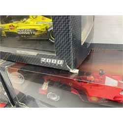 Five Mattel Hot Wheels 1:18 scale die-cast racing cars - Ferrari F1-2000 Michael Schumacher; Ferrari F-2002 Michael Schumacher; Jordan E-110 Heinz-Harald Frentzen; Williams F1 Team FW23Juan Pablo Montoya; and Ferrari F2001 Rubens Barrichello; all boxed (5)
