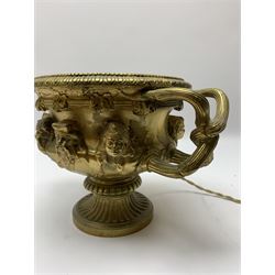19th century Grand Tour gilt bronze campagna urn or Warwick vase, decorated in relief with a band of classical male and female masks, the handles modelled as twisted vines leading to a fruiting vine beneath a beaded and lobed rim, upon a fluted socle base, H16.5cm 