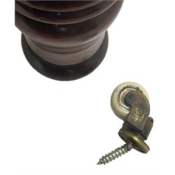 Victorian mahogany framed three-seat settee, upholstered in floral pattern fabric, on turned feet with brass and ceramic castors 