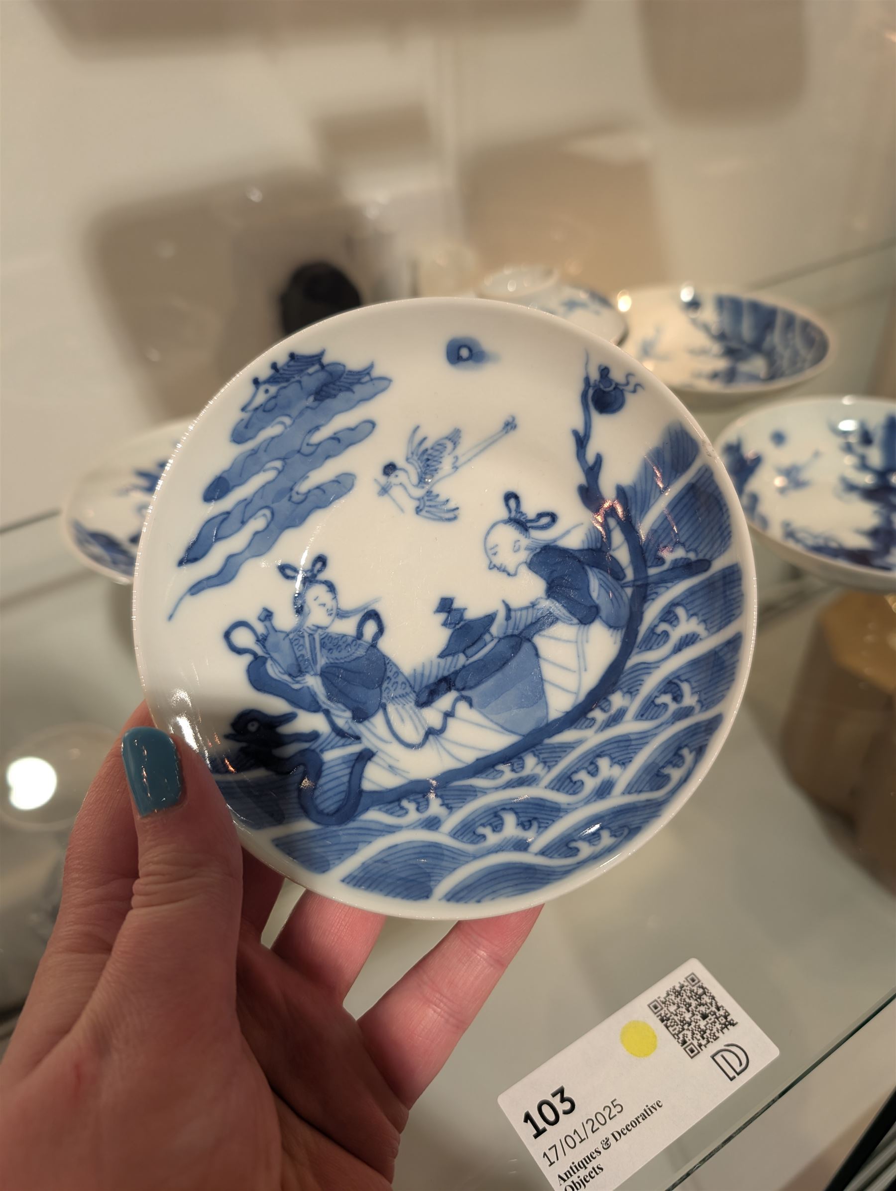 Pair of Chinese blue and white tea bowls, one with cover and four saucers, depicting two figures on a boat at sea, tea bowl H7cm