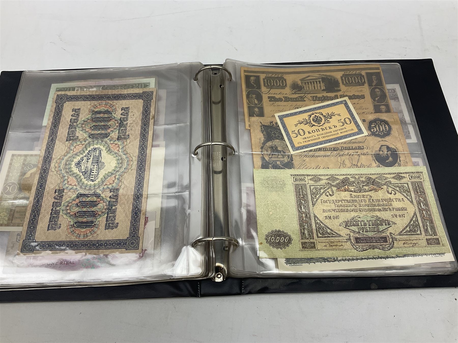 World banknotes, including Queen Elizabeth II The States of Jersey one pound 'DB202703', five pounds 'BB527762' and ten pounds 'AB651481', reserve bank of New Zealand two dollars '1L3 741894', King George V Straits Settlements one dollar 1st January 1935 'F/83 28924', various Bank of England notes etc, housed in two ring binder albums