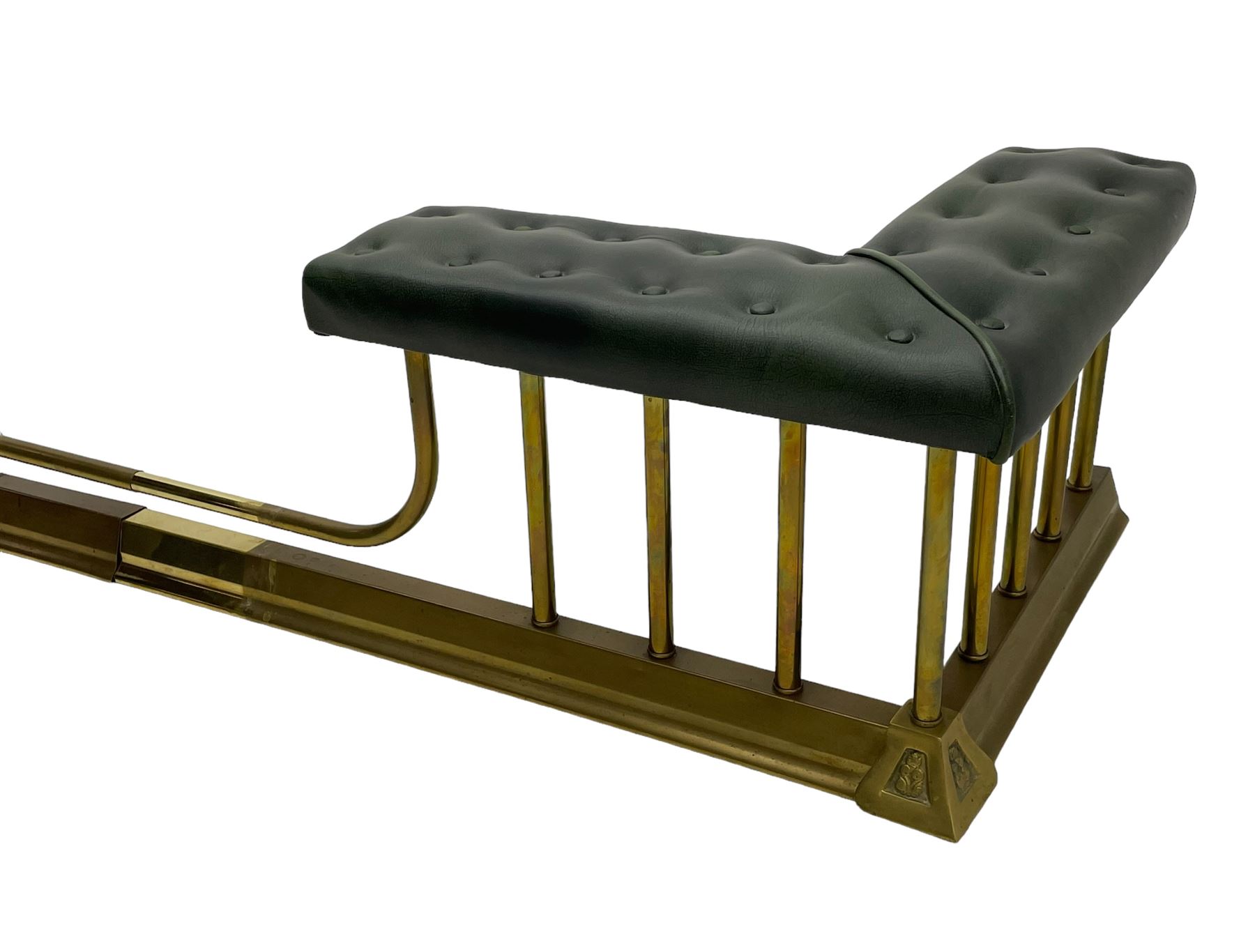Victorian design brass telescopic extending club fire fender, the corner seats upholstered in buttoned green fabric over plain balustrade, on moulded base with floral cast corner brackets 