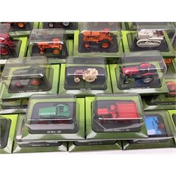 Thirty six diecast tractors, together with several issues of Tractors and The World of Farming magazine, six in original packaging and others housed in folders, in two boxes 