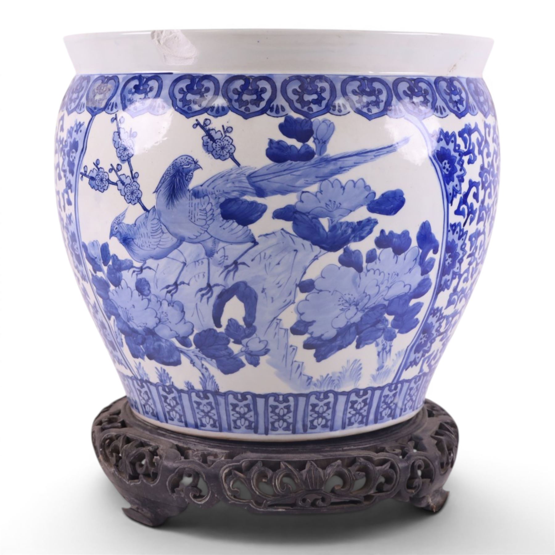 20th century blue and white fishbowl planter, decorated with birds in blossoming branches, internally decorated with goldfish, upon a wooden base, H44cm