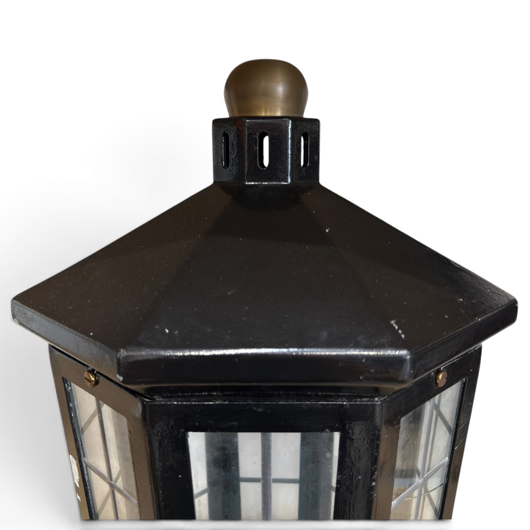 Georgian design black-painted metal octagonal hanging lantern, with brass ball finial above a hipped canopy, astragal glazed lattice panels and pendant ball terminal