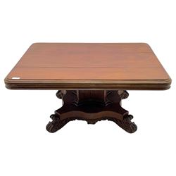 Victorian mahogany tilt-top table dining table, rounded tilt rectangular top with moulded edge, on octagonal column, raised on shaped quadriform base with bold scrolled feet
