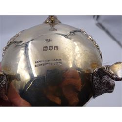 Early 20th century silver open sucrier, of circular form, with fluted gadrooned rim and decorated in relief with floral swags, united by three lion mask mounts and upon three paw feet, hallmarked Z Barraclough & Sons, London 1912, H6cm, D11cm, with similar spoon with lion mask finial, hallmarked London 1912, maker's mark indistinct