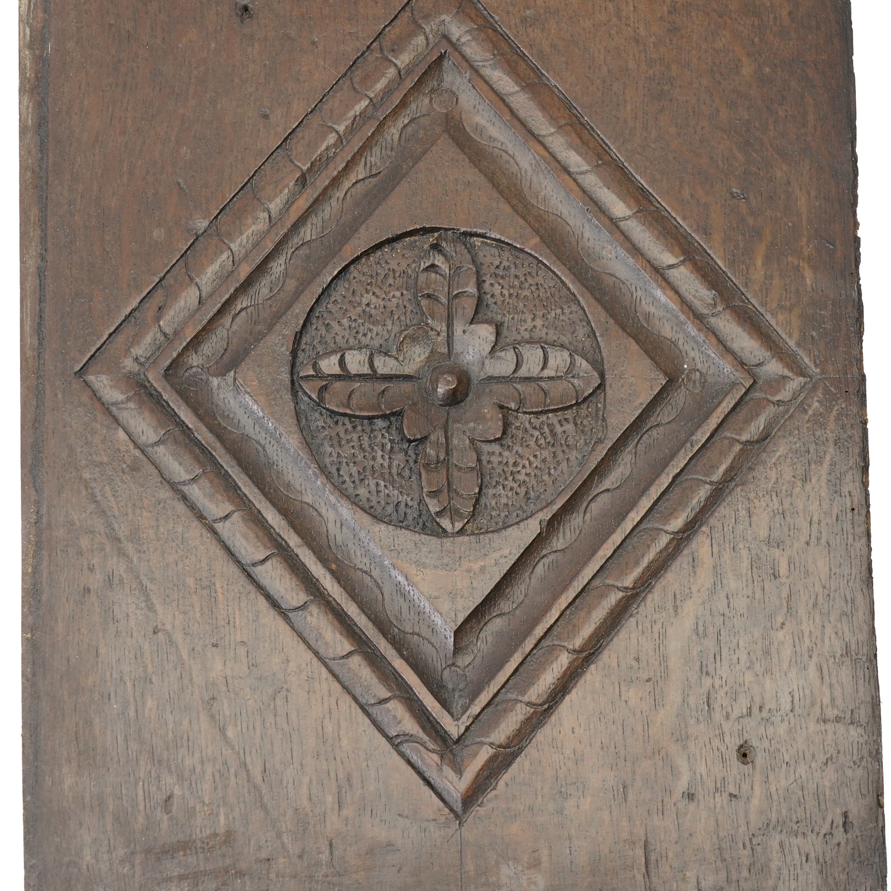 Set of four 17th century carved panels with lozenge decoration, and three further carved panels, lozenge panels approx 36.5cm x 24cm, three further 35cm x 10cm 