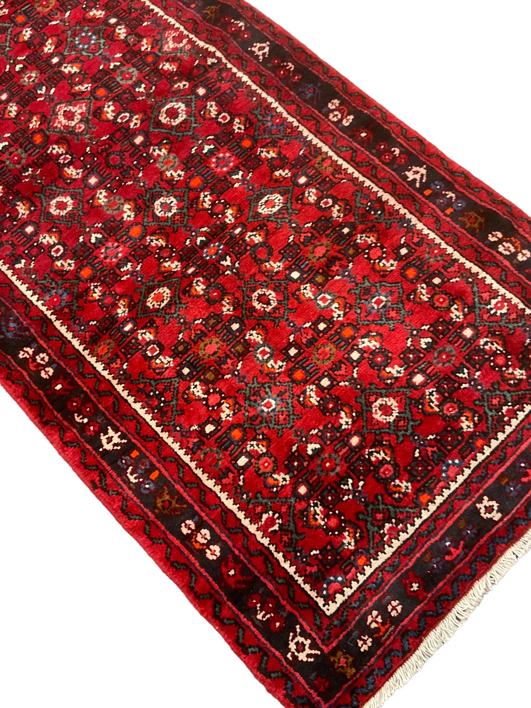 North West Persian Malayer runner, red ground field decorated with Herati motifs, guarded border decorated with trailing flowerhead band 