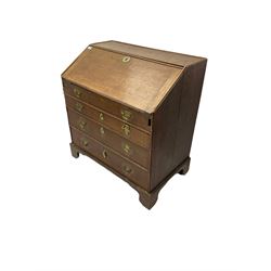 George III oak bureau, fall-front enclosing fitted interior and secret compartment, over three graduating drawers, on bracket feet