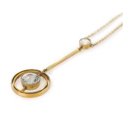 Early 20th century gold aquamarine pendant necklace, milgrain set round cut aquamarine within a pierced circular setting, to a smaller round cut aquamarine, on a fine trace link chain necklace, stamped 9ct, in a velvet and silk lined box by Leefe & Sons, Malton