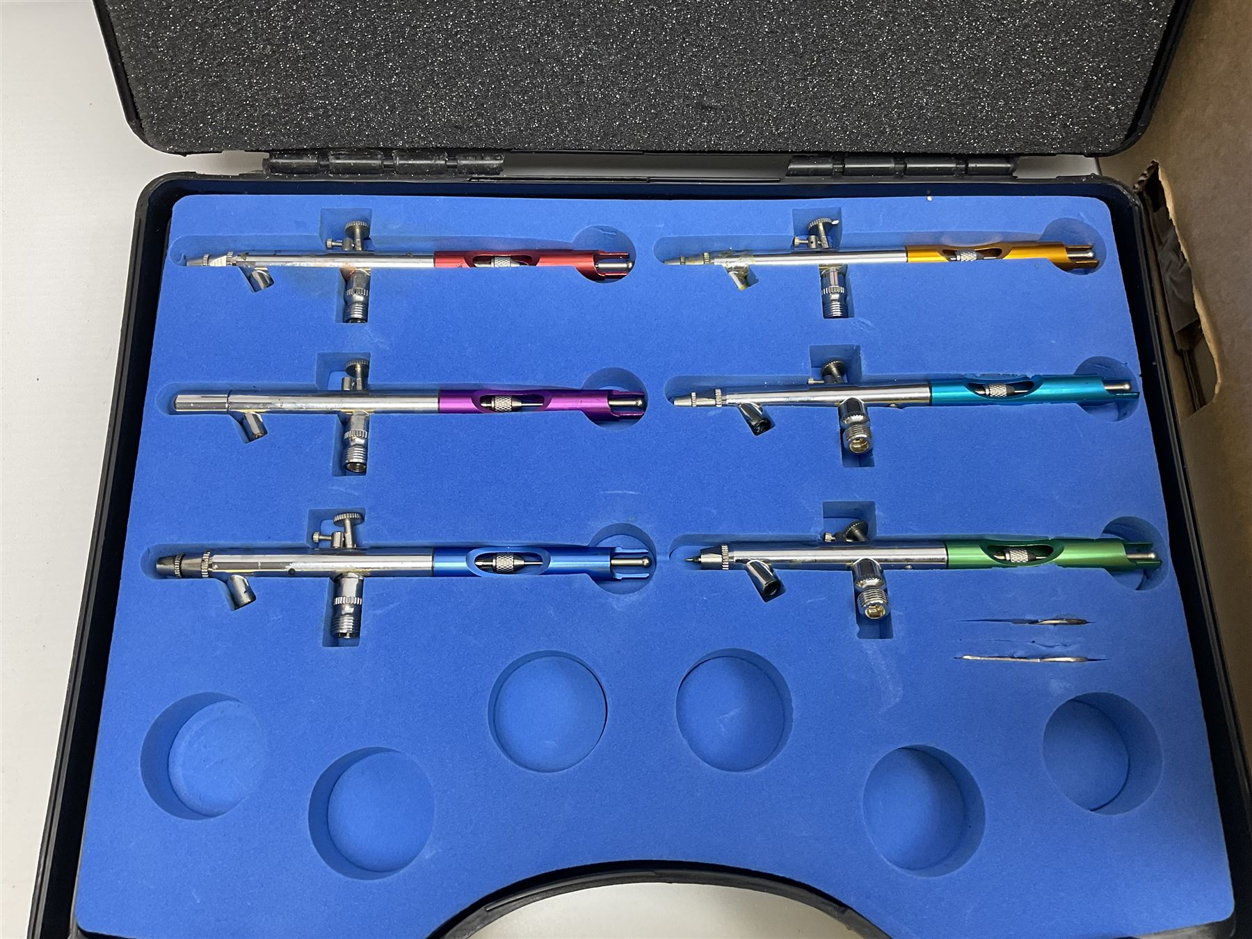 Daiwa 7700A fishing real, together with ice skate blades, pen nibs and other collectables 