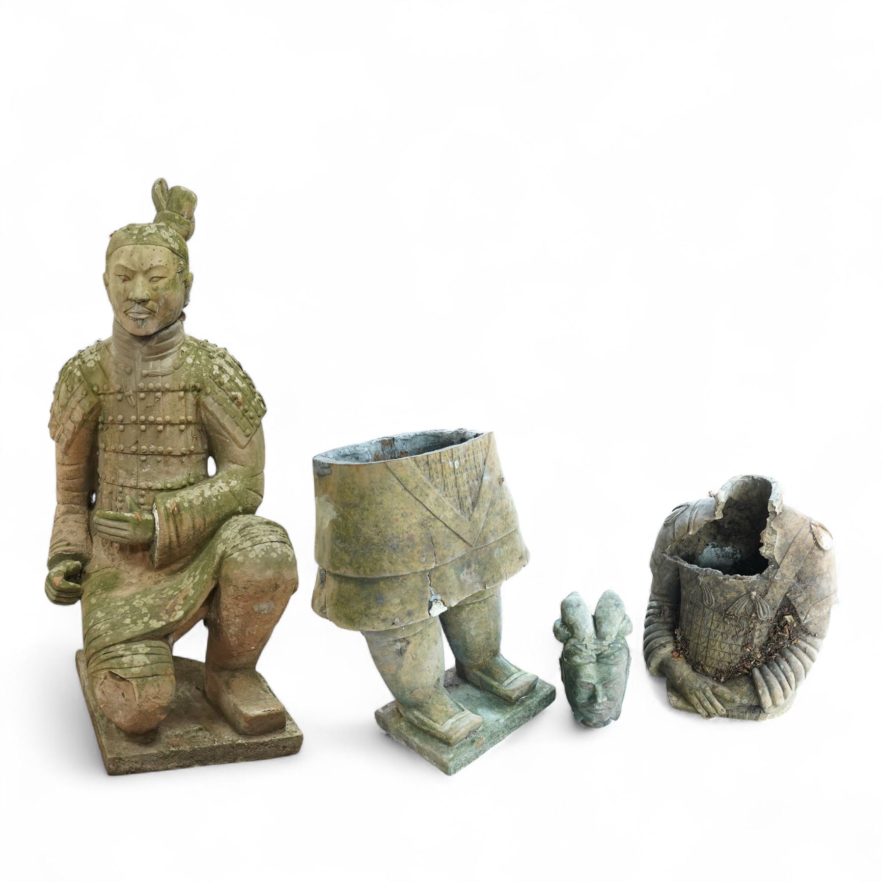 Two near life-size terracotta warrior figures, modelled in the style of the Qin dynasty soldiers, each kneeling with one arm raised, wearing detailed armour and tunics, one example partially damaged and lacking sections