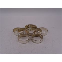 Set of eight modern silver napkin rings, of plain oval form, hallmarked with import marks for Birmingham