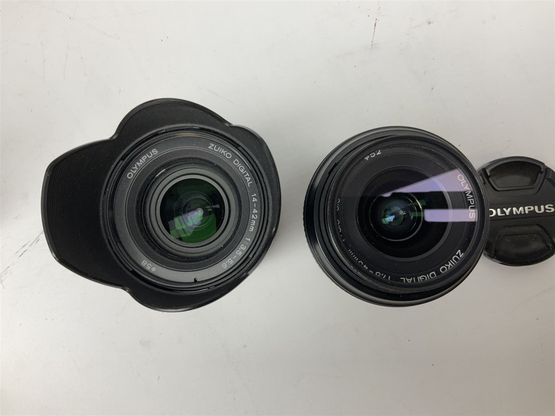 Three Olympus Camera bodies, comprising of OM-D E-M5, E-400 and E-450,   together with 'Samyang Mirror Lens 800mm 1:8.0DX', Olympus 'Zuiko Digital 40-150mm 1;3.5-4.5mm' lens, three other lenses and Velbon CX444 tripod 