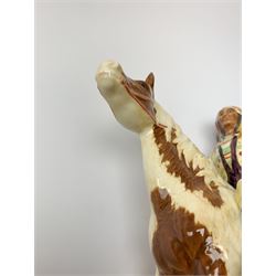 A Beswick Native American on horseback, with printed mark beneath, H21.5cm. 