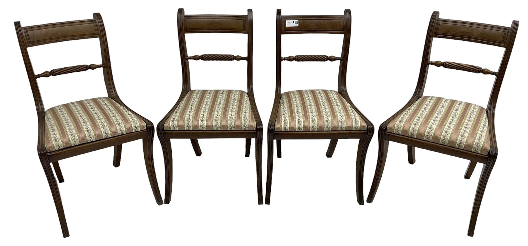 Set of four Regency period mahogany dining chairs, rope-twist centre back bar over pink and ivory floral patterned drop-in seats, on reed moulded sabre supports