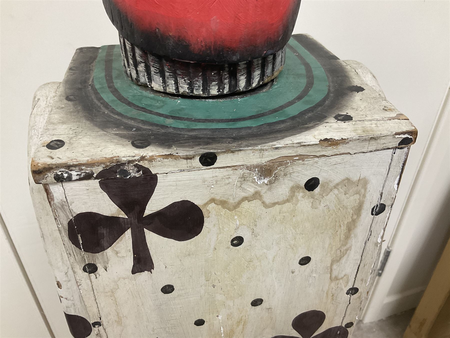 Folk art circus clown cabinet, the the two hinged doors with bow tie decoration opening to reveal fitted shelved interior, the body painted with polka dots and spades, H121cm
