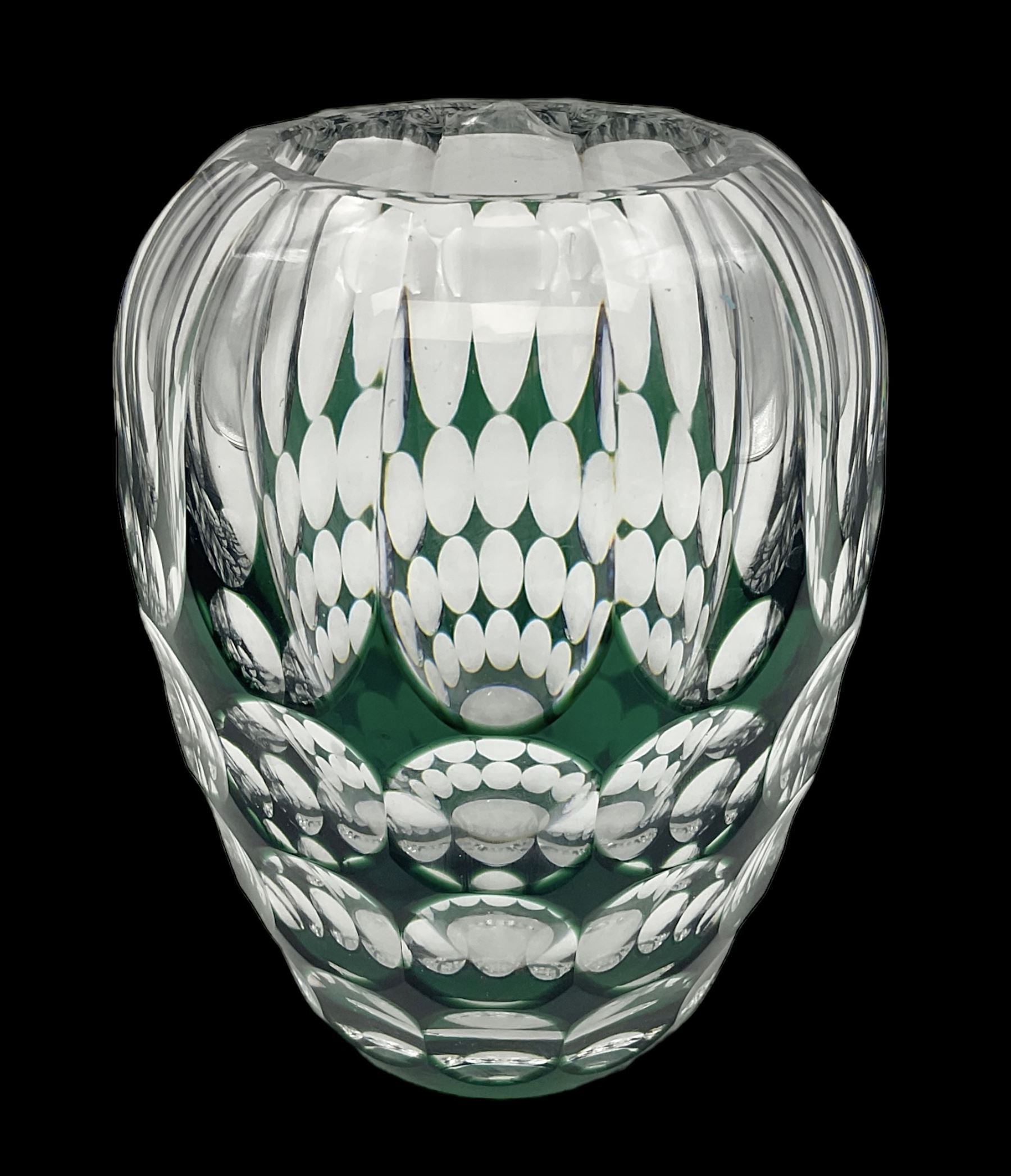 Val St Lambert style glass vase of shouldered ovoid form, cased in deep green over clear and heavily cut with repeat spherical pattern, indistinctly signed beneath ('Jac E. Dalmley'?), H15cm