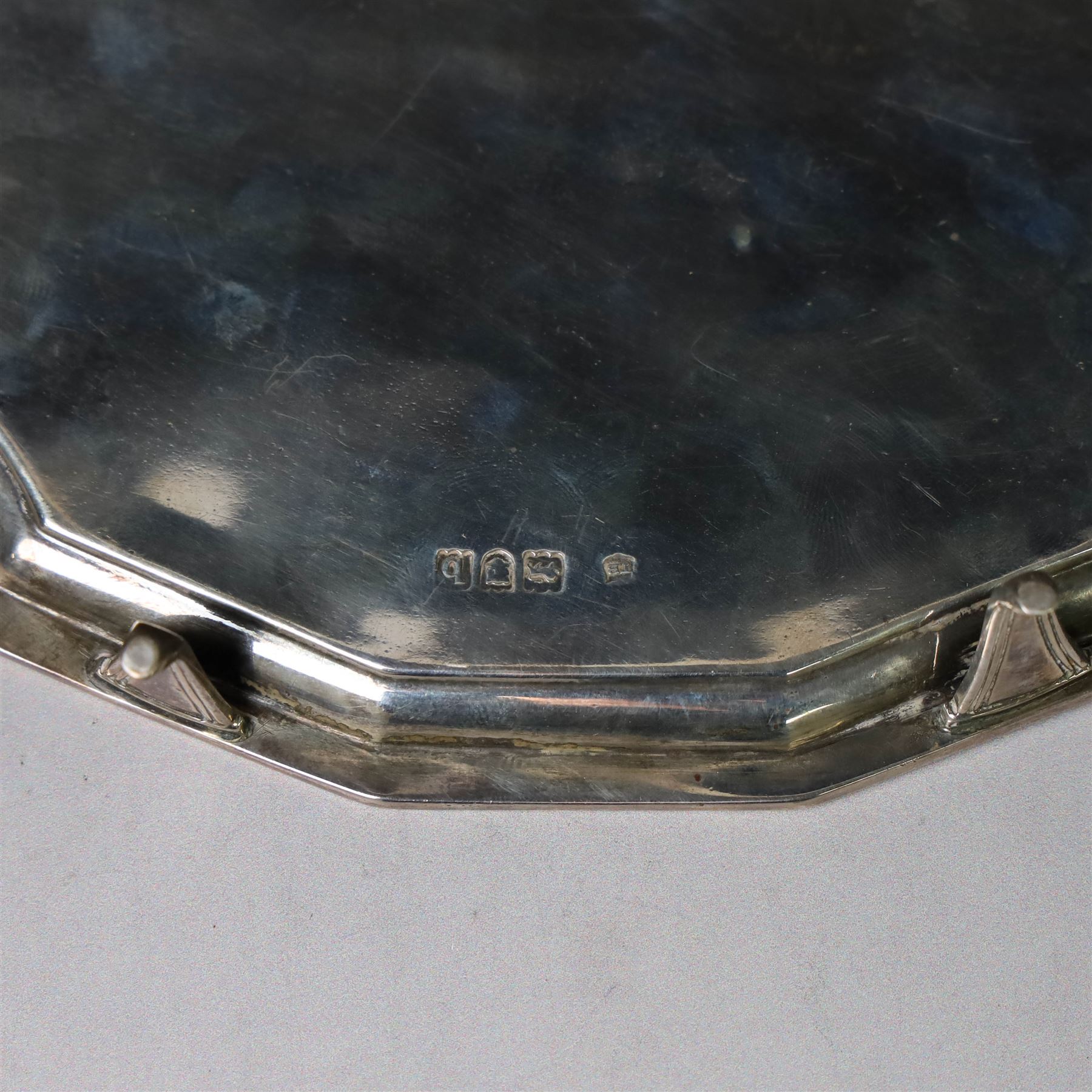 Victorian silver teapot stand, with chippendale style rim and engraved crest to centre, upon four pad feet, hallmarked Thomas Bradbury & Sons, London 1897, W18cm