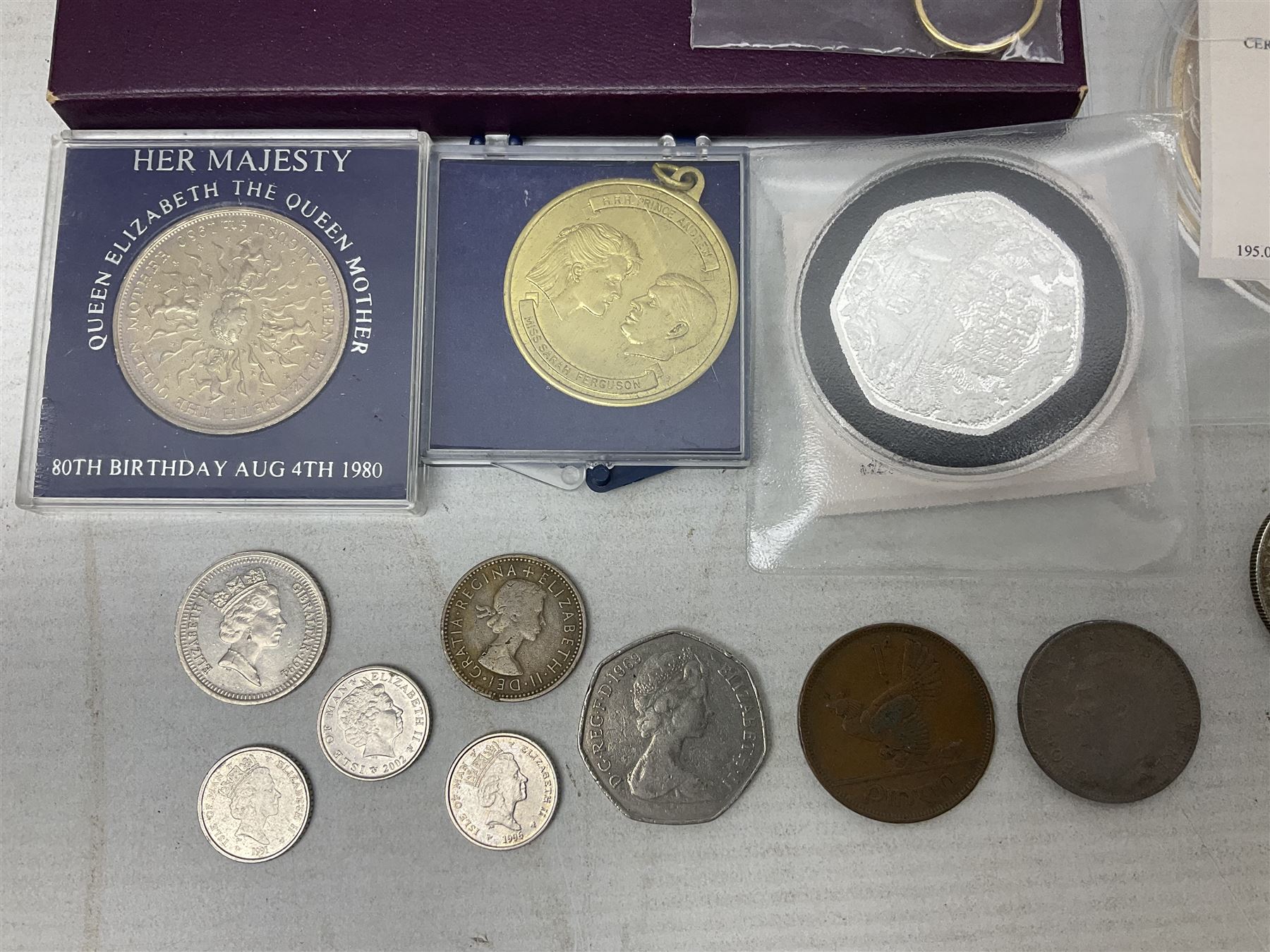 Coins and sets, including Great Britain and Northern Ireland 1970 proof coin collection in card folder, Queen Elizabeth II 2021 'Through the Looking Glass' five pounds, 2021 'Winnie the Pooh' fifty pence, Queen Victoria 1887 halfcrown, King George V 1914 halfcrown, commemorative coins, The Royal Mint Solomon Islands 2003 twenty-five dollars silver proof coin cased with certificate, 9ct gold half sovereign mount etc