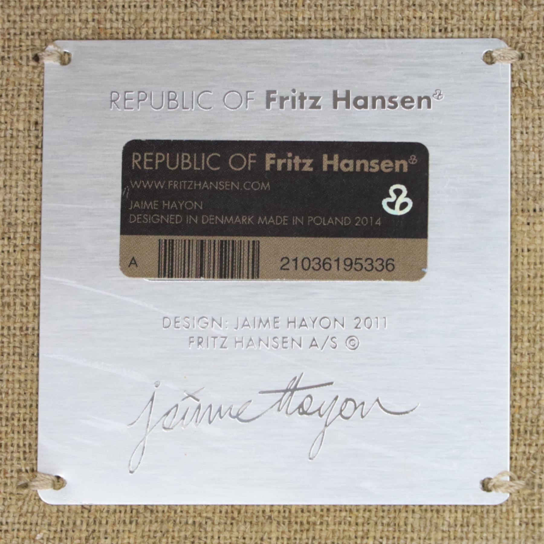 Fritz Hansen - 'Favn' sofa, designed by Jaime Hayon (1974-), upholstered in light grey fabric, the organic curved back and integrated arms enclosing loose seat and back cushions, raised on slender cylindrical metal supports