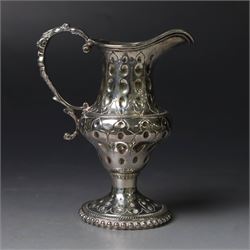 George III silver cream jug, of baluster form with hammered dimpling throughout and scroll handle, upon circular spreading foot with beaded edge, hallmarked Thomas Shepherd, London 1784, H10cm