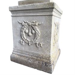 Pair of quality Neoclassical design Haddonstone cast stone garden urns, the globular  body decorated with relief foliate festoons and fruiting motifs, over a fluted socle, the rectangular pedestals with relief foliate wreaths and ribbon garlands